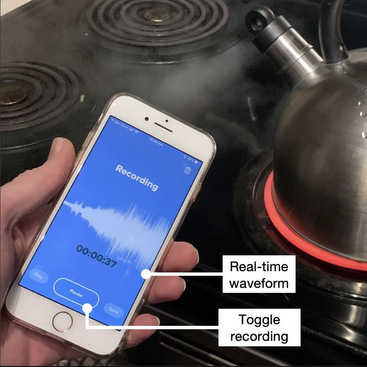 Image from Figure 2 of the paper, showing a participant recording a kettle boiling sound on a smartphone recording app. Copied here for decorative purposes.