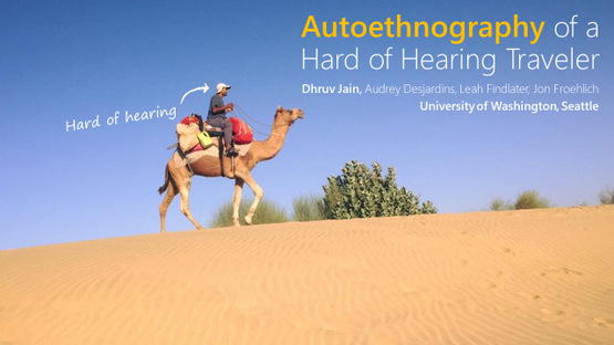 First slide of the talk. Shows DJ riding on a camel in a desert. The title of the talk reads: Autoethography of a Hard of Hearing Traveler